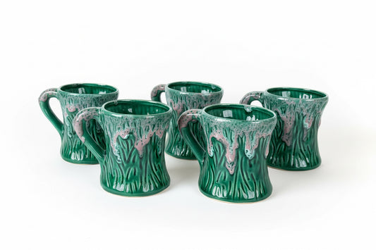 Tazze verdi con colature