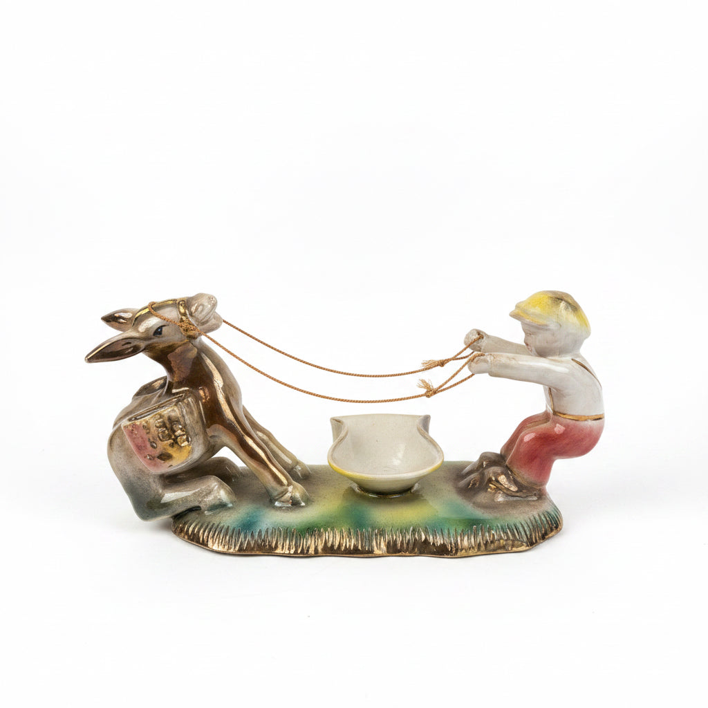 Scultura bimbo con asino